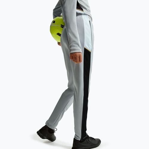 Dětské tepláky Nike Academy Dri-Fit Jr light smoke grey/white/black/metallic gold