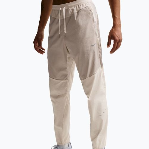 Pánské běžecké kalhoty Nike Stride Repel Woven cream li/birch/natural