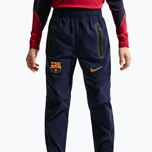 Dětské fotbalové kalhoty Nike FC Barcelona Tech Woven blackened blue/black/mineral yellow