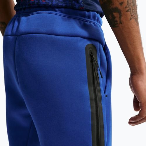 Pánské fotbalové kalhoty Nike FFF Tech Fleece Joggers game royal/metallic copper