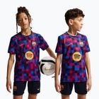 Dětské fotbalové tričko Nike FC Barcelona Dri-Fit Pre-Match noble red/mineral yellow