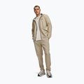 Pánské tréninkové kalhoty Under Armour Unstoppable Tapered Pants city khaki/black 2