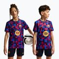 Dětské fotbalové tričko Nike FC Barcelona Dri-Fit Pre-Match noble red/mineral yellow