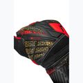 Brankářské rukavice Reusch Attrakt Solid black/gold/fiery red 6