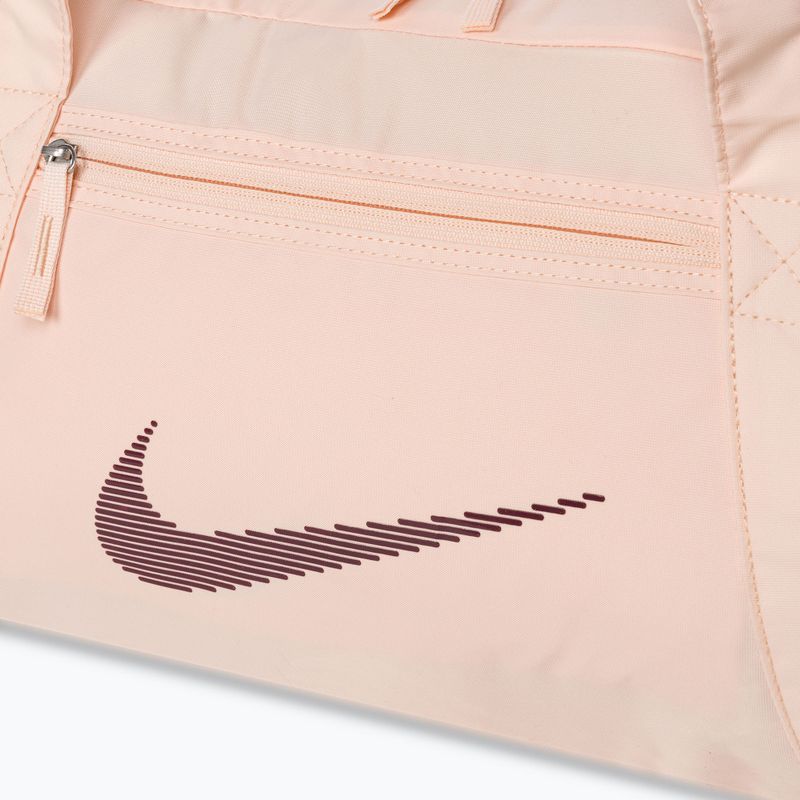 Dámská sportovní taška Nike Gym Club 24 l guava ice/guava ice/night maroon 4