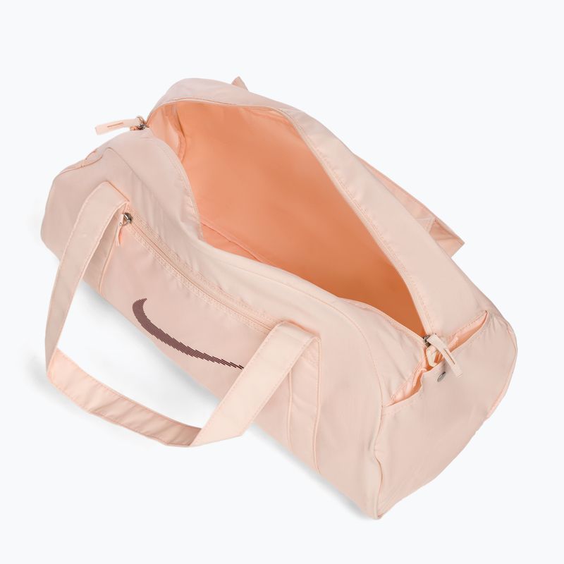 Dámská sportovní taška Nike Gym Club 24 l guava ice/guava ice/night maroon 5