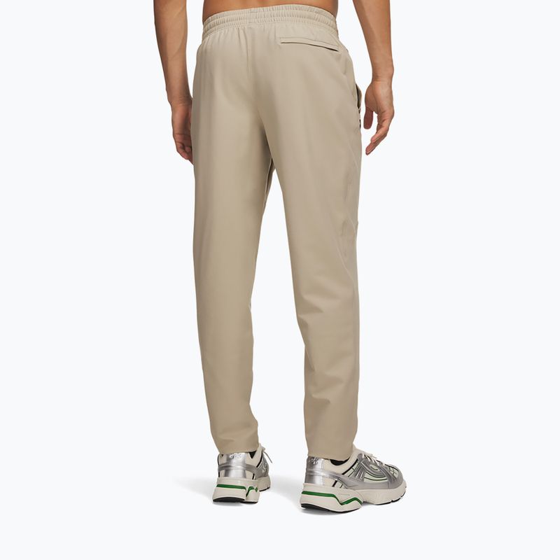 Pánské tréninkové kalhoty Under Armour Unstoppable Tapered Pants city khaki/black 3