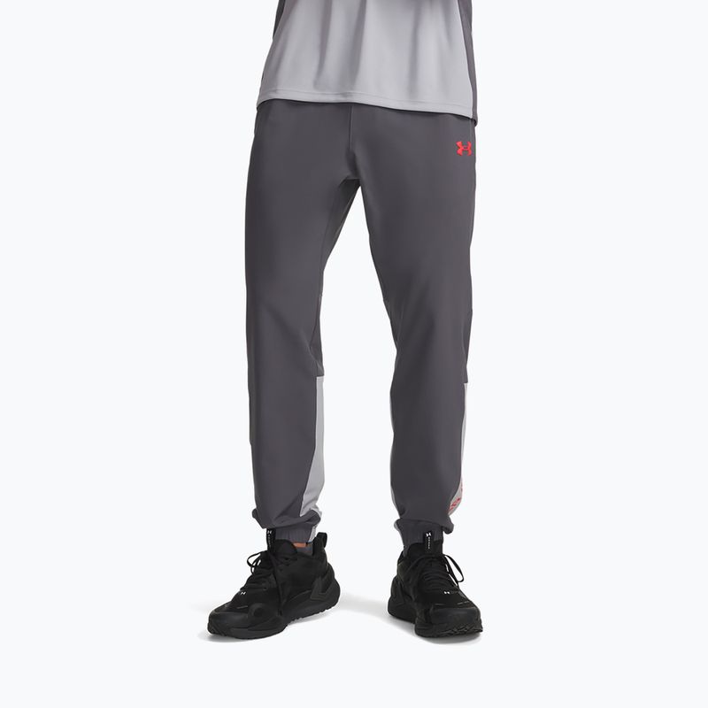 Pánské tréninkové kalhoty Under Armour Tech Utility Woven Pants castlerock/mod gray/racer red