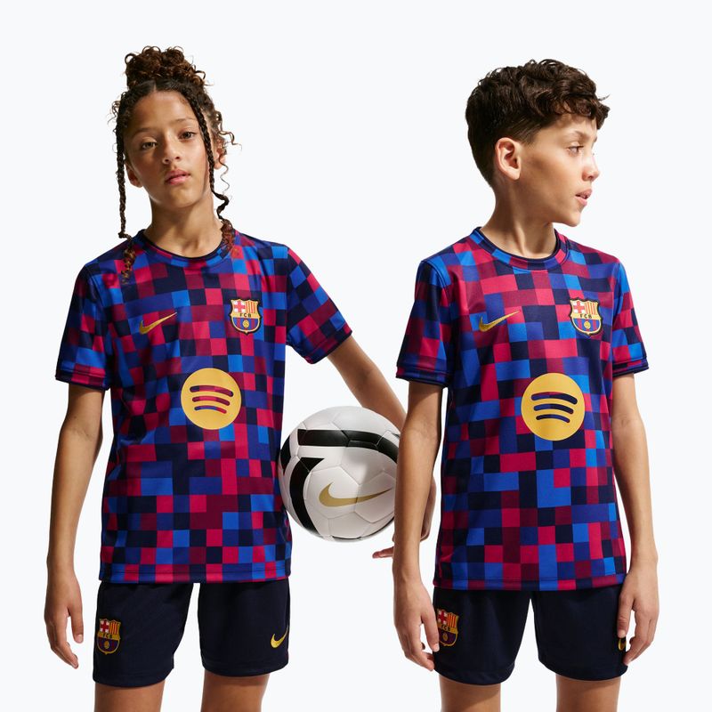 Dětské fotbalové tričko Nike FC Barcelona Dri-Fit Pre-Match noble red/mineral yellow