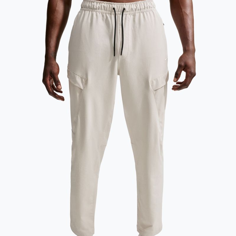 Pánské kalhoty Nike Unlimited ight orewood brown/black/light orewood brown
