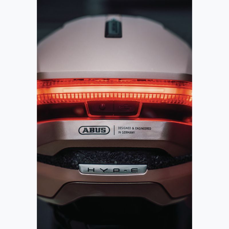 Cyklistická helma s blinkry ABUS Hyp-E champagne gold 9