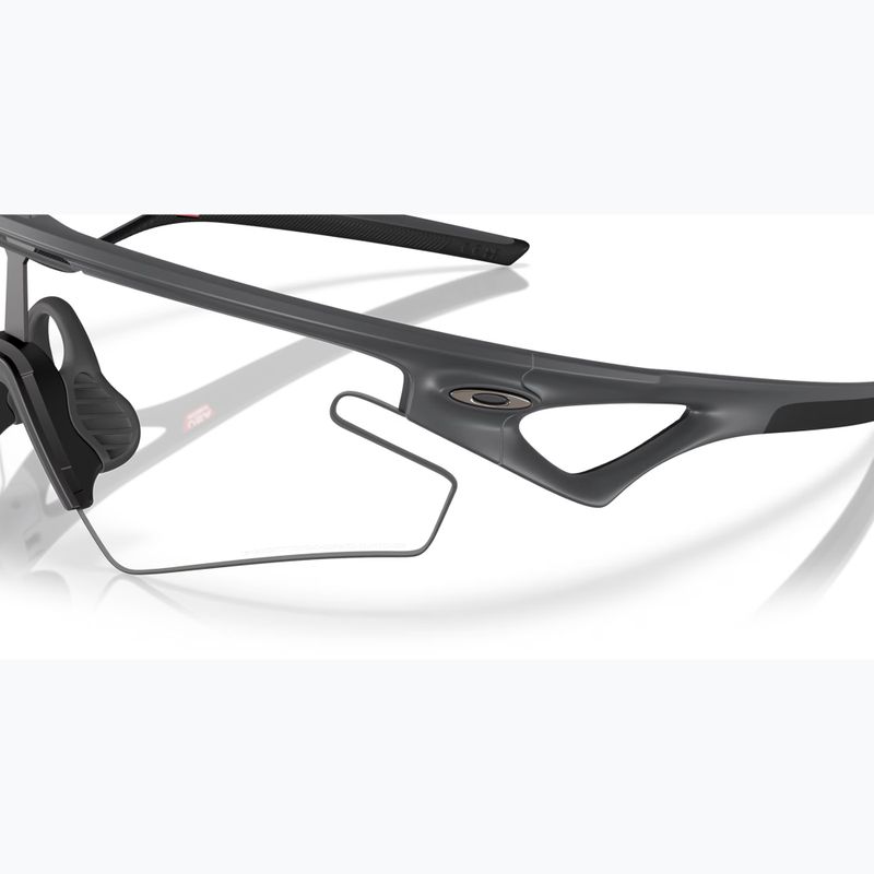 Sluneční brýle Oakley Sphaera Slash carbon/clear to black iridium photochromic 6