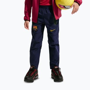 Dětské fotbalové kalhoty Nike FC Barcelona Tech Woven blackened blue/black/mineral yellow